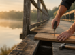 A man repairing a wooden bridge, representing rebuilding trust after betrayal through consistent action.